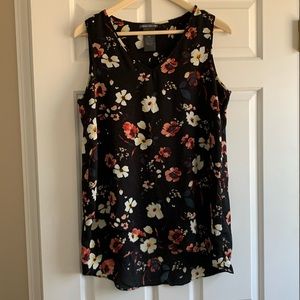 Black with flower print. Loose fit lightweight sleeveless blouse